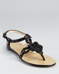 Braided rope, studded hardware and snakeskin details come together on a standout sandal from Calvin Klein. Braided rope, studded hardware and snakeskin details come together on a standout sandal from Calvin Klein.