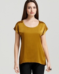 Sumptuous silk lends elegant movement to a vibrant Eileen Fisher blouse. Let the style pop against crisp, black suiting for corner-office chic. Sumptuous silk lends elegant movement to a vibrant Eileen Fisher blouse. Let the style pop against crisp, black suiting for corner-office chic.