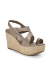 THE LOOKToe ringCutout leather upperElastic slingback strapWoven espadrille wedge, 3½ (90mm)Woven espadrille platform, 1½ (40mm)Compares to a 2 heel (50mm)THE MATERIALLeather upperLeather liningLeather and rubber soleORIGINImported