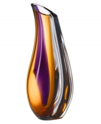 With the extraordinary beauty and grace of an orchid blossom, this Kosta Boda vase adds brilliant artistry to modern interiors. Luxurious art glass hand-crafted in an easy, fluid shape glistens with streaks of rich violet and warm amber. With the extraordinary beauty and grace of an orchid blossom, this Kosta Boda vase adds brilliant artistry to modern interiors. Luxurious art glass hand-crafted in an easy, fluid shape glistens with streaks of rich violet and warm amber.