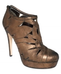 Gorgeous sheen. The Trisha high heel booties by DKNY Bridge Collection have a shimmering upper with cute cutouts along the vamp. Gorgeous sheen. The Trisha high heel booties by DKNY Bridge Collection have a shimmering upper with cute cutouts along the vamp.