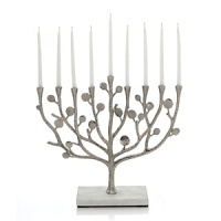 Nature-inspired, Michael Aram's Botanical Leaf collection calls to mind the leaves and twisting branches of eucalyptus and seagrape. Artfully designed, this unique menorah makes an eye-catching centerpiece during Hanukkah and beyond. Nature-inspired, Michael Aram's Botanical Leaf collection calls to mind the leaves and twisting branches of eucalyptus and seagrape. Artfully designed, this unique menorah makes an eye-catching centerpiece during Hanukkah and beyond.