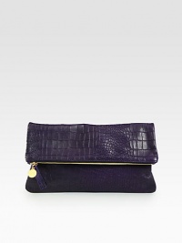 Beautiful in its simplicity, this on-trend, oversized leather clutch is a chic way to add a hint of the exotic to your everyday look.Top zipperCotton lining12W X 6¼H X ½DMade in USA Beautiful in its simplicity, this on-trend, oversized leather clutch is a chic way to add a hint of the exotic to your everyday look.Top zipperCotton lining12W X 6¼H X ½DMade in USA
