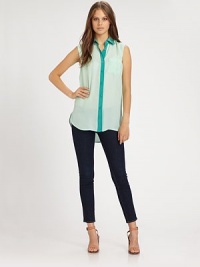 Dreamy silk chiffon elevates this tailored button-down finished with supple satin trim and a chic sleeveless silhouette.Point collarButton-down placketSleevelessLong sleeves with button cuffsHem is longer in backAbout 30 from shoulder to hemSilkDry cleanMade in USAModel shown is 5'10 (177cm) wearing US size Small. Dreamy silk chiffon elevates this tailored button-down finished with supple satin trim and a chic sleeveless silhouette.Point collarButton-down placketSleevelessLong sleeves with button cuffsHem is longer in backAbout 30 from shoulder to hemSilkDry cleanMade in USAModel shown is 5'10 (177cm) wearing US size Small.
