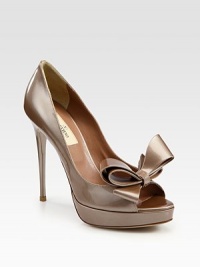 Glimmering patent leather with a classic bow adornment and peep toe. Self-covered heel, 5 (125mm)Covered platform, 1 (25mm)Compares to a 4 heel (100mm)Patent leather upperLeather lining and solePadded insoleMade in ItalyOUR FIT MODEL RECOMMENDS ordering one half size up as this style runs small. Glimmering patent leather with a classic bow adornment and peep toe. Self-covered heel, 5 (125mm)Covered platform, 1 (25mm)Compares to a 4 heel (100mm)Patent leather upperLeather lining and solePadded insoleMade in ItalyOUR FIT MODEL RECOMMENDS ordering one half size up as this style runs small.
