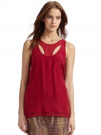 An ultra modern look in washed silk charmeuse, redesigned with chiffon racerstyle detailing at the front and back.Scoopneck Pullover style Sleeveless Chiffon racerstyle details, front and back About 25½ from shoulder to hem Silk with silk chiffon lining Dry clean Imported An ultra modern look in washed silk charmeuse, redesigned with chiffon racerstyle detailing at the front and back.Scoopneck Pullover style Sleeveless Chiffon racerstyle details, front and back About 25½ from shoulder to hem Silk with silk chiffon lining Dry clean Imported
