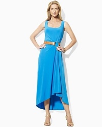 Infused with romantic movement, a sleek tank dress is crafted with subtle pleating at the waist that creates a fluid draped hemline. Infused with romantic movement, a sleek tank dress is crafted with subtle pleating at the waist that creates a fluid draped hemline.