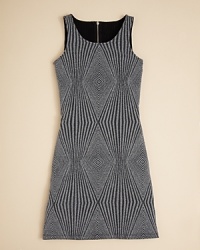 Aqua cuts this sleeveless dress to perfection, adding an allover diamond pattern with a glitter finish. Aqua cuts this sleeveless dress to perfection, adding an allover diamond pattern with a glitter finish.