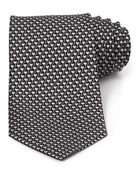 This handsome silk tie from Salvatore Ferragamo, cut in a classic silhouette for traditional appeal, helps you transition from the office into your evening affairs. This handsome silk tie from Salvatore Ferragamo, cut in a classic silhouette for traditional appeal, helps you transition from the office into your evening affairs.