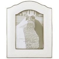 Opal Innocence, the popular china pattern from Lenox, lends a romantic feel to this fine china frame. Here, pearl-like enamel dots are elegant against an opalescent background. The frame, trimmed in precious platinum, makes a perfect engagement or wedding gift. The frame holds one 5 x 7 photo and is crafted of Lenox white bone china accented with precious platinum.Height: 9 1/2Width: 7 3/4 Opal Innocence, the popular china pattern from Lenox, lends a romantic feel to this fine china frame. Here, pearl-like enamel dots are elegant against an opalescent background. The frame, trimmed in precious platinum, makes a perfect engagement or wedding gift. The frame holds one 5 x 7 photo and is crafted of Lenox white bone china accented with precious platinum.Height: 9 1/2Width: 7 3/4