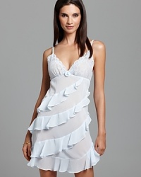 In sheer, airy chiffon, Oscar de la Renta Pink Label's Flirtatious Ruffles chemise lends ethereal style to your at-home look. In sheer, airy chiffon, Oscar de la Renta Pink Label's Flirtatious Ruffles chemise lends ethereal style to your at-home look.