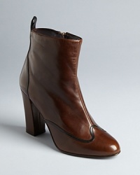 These Delman booties take Western influences into luxurious style, with ladylike piping, streamlined ankles and sleek heels. These Delman booties take Western influences into luxurious style, with ladylike piping, streamlined ankles and sleek heels.