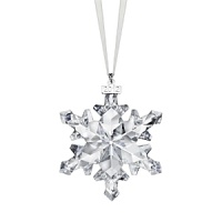 Recalling a delicate natural snowflake in sparkling crystal, this festive holiday ornament from Swarovski features a tiny silvery tag engraved with the year 2012.