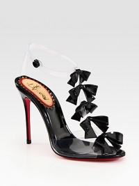 Pretty patent leather bows add feminine style to this chic t-strap silhouette of translucent PVC. Patent leather-covered heel, 4¼ (110mm)Patent leather and PVC upperAnkle strap with snap closurePatent leather liningSignature red leather solePadded insoleMade in Italy Pretty patent leather bows add feminine style to this chic t-strap silhouette of translucent PVC. Patent leather-covered heel, 4¼ (110mm)Patent leather and PVC upperAnkle strap with snap closurePatent leather liningSignature red leather solePadded insoleMade in Italy