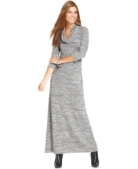 Studio M's dress features a light-catching metallic knit and a sleek maxi silhouette. Studio M's dress features a light-catching metallic knit and a sleek maxi silhouette.