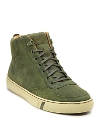 Rendered in luxe suede, this updated version of a classic Pro-Keds sneaker boasts topstitch detailing and a contrasting lining. Rendered in luxe suede, this updated version of a classic Pro-Keds sneaker boasts topstitch detailing and a contrasting lining.