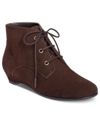 Streamlined style. Aerosole's Soterday Night booties feature a lace-up vamp with gunmetal eyelets and a flexible rubber sole. Streamlined style. Aerosole's Soterday Night booties feature a lace-up vamp with gunmetal eyelets and a flexible rubber sole.