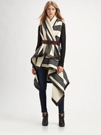 Pay homage to British tailoring in this blanket-inspired wrap coat with opposing stripe patterns, arm slits and buttery leather trim. Shawl collarArm slitsAsymmetrical hemFully linedAbout 44 from shoulder to hem at longest pointBody: 60% wool/33% polychloride/7% polyacetateTrim: LeatherDry clean with leather specialistMade in USA of Italian fabricThis style runs true to size. We recommend ordering your usual size for a standard fit. 