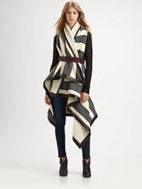Pay homage to British tailoring in this blanket-inspired wrap coat with opposing stripe patterns, arm slits and buttery leather trim. Shawl collarArm slitsAsymmetrical hemFully linedAbout 44 from shoulder to hem at longest pointBody: 60% wool/33% polychloride/7% polyacetateTrim: LeatherDry clean with leather specialistMade in USA of Italian fabricThis style runs true to size. We recommend ordering your usual size for a standard fit. Pay homage to British tailoring in this blanket-inspired wrap coat with opposing stripe patterns, arm slits and buttery leather trim. Shawl collarArm slitsAsymmetrical hemFully linedAbout 44 from shoulder to hem at longest pointBody: 60% wool/33% polychloride/7% polyacetateTrim: LeatherDry clean with leather specialistMade in USA of Italian fabricThis style runs true to size. We recommend ordering your usual size for a standard fit.
