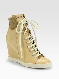 Leather and suede style with a lace-up front and covered wedge. Self-covered wedge, 3¼ (80mm)Leather and suede upperLace-up frontLeather liningRubber solePadded insoleMade in ItalyOUR FIT MODEL RECOMMENDS ordering one size up as this style runs small. Leather and suede style with a lace-up front and covered wedge. Self-covered wedge, 3¼ (80mm)Leather and suede upperLace-up frontLeather liningRubber solePadded insoleMade in ItalyOUR FIT MODEL RECOMMENDS ordering one size up as this style runs small.