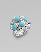 A wide ring, finished in the sophistication of turquoise, and exquisitely placed on a maze of sterling silver. Turquoise Sterling silver Width, about ¾ Imported