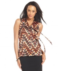 Get on trend with ABG's sleeveless blouse, featuring a bold graphic print and feminine tie-neck detail. (Clearance) Get on trend with ABG's sleeveless blouse, featuring a bold graphic print and feminine tie-neck detail. (Clearance)