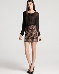 Raglan sleeves lend a youthful look to a sophisticated lace dress from Aidan Mattox. Raglan sleeves lend a youthful look to a sophisticated lace dress from Aidan Mattox.