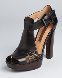 A bold yet versatile sandal from Modern Vintage--polished and pretty with tights and sleek with skinnies. A bold yet versatile sandal from Modern Vintage--polished and pretty with tights and sleek with skinnies.