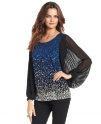 Pleated sleeves and a printed body give this Alfani top stylish appeal. Pleated sleeves and a printed body give this Alfani top stylish appeal.