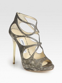 Strappy platform silhouette of lizard-embossed leather with a sleek goldtone heel. Metal heel, 4¾ (120mm)Covered platform, ½ (15mm)Compares to a 4¼ heel, (110mm)Lizard-embossed leather upperBack zipLeather lining and solePadded insoleMade in ItalyOUR FIT MODEL RECOMMENDS ordering one half size up as this style runs small. Strappy platform silhouette of lizard-embossed leather with a sleek goldtone heel. Metal heel, 4¾ (120mm)Covered platform, ½ (15mm)Compares to a 4¼ heel, (110mm)Lizard-embossed leather upperBack zipLeather lining and solePadded insoleMade in ItalyOUR FIT MODEL RECOMMENDS ordering one half size up as this style runs small.