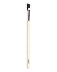 A small, soft angled brush to shape eyebrows. Made of boar bristle. A small, soft angled brush to shape eyebrows. Made of boar bristle.