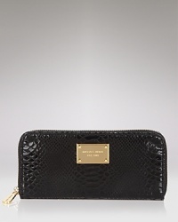Lend your look contemporary polish with this python-embossed patent leather continental wallet from MICHAEL Michael Kors. Lend your look contemporary polish with this python-embossed patent leather continental wallet from MICHAEL Michael Kors.