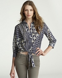 A unique spin on the classic button-up, this Velvet by Graham & Spencer top flaunts an eclectic print and a chic tie at the waist. A unique spin on the classic button-up, this Velvet by Graham & Spencer top flaunts an eclectic print and a chic tie at the waist.