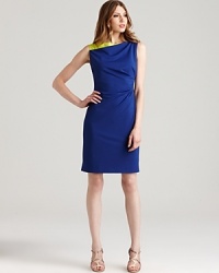 Ultramarine is accented with neon lime on Elie Tahari's Olympia dress, a color-rich look on an asymmetric silhouette. Ultramarine is accented with neon lime on Elie Tahari's Olympia dress, a color-rich look on an asymmetric silhouette.