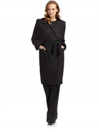 THE LOOKDramatic fold-over collarDouble breasted snap frontButton and loop frontLong sleevesTie-belt at waistDual patch pocketsTHE FITAbout 40½ from shoulder to hemTHE MATERIAL60% virgin wool/40% angoraRayon liningCARE & ORIGINDry cleanMade in Italy THE LOOKDramatic fold-over collarDouble breasted snap frontButton and loop frontLong sleevesTie-belt at waistDual patch pocketsTHE FITAbout 40½ from shoulder to hemTHE MATERIAL60% virgin wool/40% angoraRayon liningCARE & ORIGINDry cleanMade in Italy