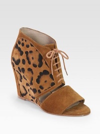 Lace-up suede confection with a unique leopard print and cutout front. Self-covered wedge, 3½ (90mm)Leopard-print suede upperLeather lining and solePadded insoleImported Lace-up suede confection with a unique leopard print and cutout front. Self-covered wedge, 3½ (90mm)Leopard-print suede upperLeather lining and solePadded insoleImported