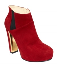 A flash of metal detail on the inside heel of GUESS's Coreline platform booties complements the luxe suede upper, making this cute pair one that's easy to dress up or down. A flash of metal detail on the inside heel of GUESS's Coreline platform booties complements the luxe suede upper, making this cute pair one that's easy to dress up or down.