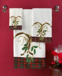 Delight and dazzle this season with the Lenox Holiday Nouveau bath towel, featuring a traditional holiday plaid and holly embellished with glittery gold accents. Delight and dazzle this season with the Lenox Holiday Nouveau bath towel, featuring a traditional holiday plaid and holly embellished with glittery gold accents.