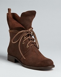 This KORS Michael Kors design takes a fresh stance on the Western trend, with rough-and-ready rawhide laces and loads of schoolmarm charm: yes, ma'am! This KORS Michael Kors design takes a fresh stance on the Western trend, with rough-and-ready rawhide laces and loads of schoolmarm charm: yes, ma'am!