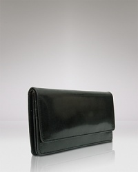 Give into practical accessorizing with this patent Italian leather clutch wallet from Tusk. It's profile is pocket perfect, while a glossy exterior lends polish. Give into practical accessorizing with this patent Italian leather clutch wallet from Tusk. It's profile is pocket perfect, while a glossy exterior lends polish.