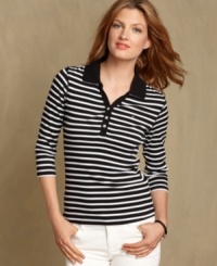 The polo top gets a sporty-chic update with stripes and a V-neckline in Tommy Hilfiger's preppy must-have. The polo top gets a sporty-chic update with stripes and a V-neckline in Tommy Hilfiger's preppy must-have.