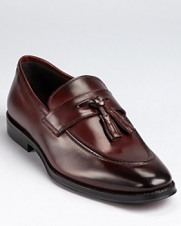 Sleek dress loafers crafted in burnished Italian leather and finished with a double tassel detail at the tongue. Sleek dress loafers crafted in burnished Italian leather and finished with a double tassel detail at the tongue.