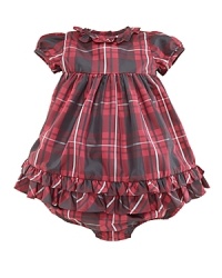 A classic, timeless plaid is transformed into an adorable babydoll dress with requisite ruffle trim along the neck and hem. A classic, timeless plaid is transformed into an adorable babydoll dress with requisite ruffle trim along the neck and hem.