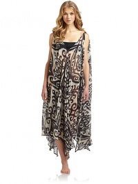 THE LOOKExotic inspired print on sheer, flowy chiffonOne dress, so many ways to wear itBelted, one-shoulder, crisscross or bring in 2 points on the hem to cinch the waistIncludes tag with styling optionsV-neckAsymmetrical hemLong side slitsTHE FITAbout 45 from shoulder to longest point of hemTHE MATERIALPolyesterCARE & ORIGINHand washMade in USAPlease note: One size fits most. THE LOOKExotic inspired print on sheer, flowy chiffonOne dress, so many ways to wear itBelted, one-shoulder, crisscross or bring in 2 points on the hem to cinch the waistIncludes tag with styling optionsV-neckAsymmetrical hemLong side slitsTHE FITAbout 45 from shoulder to longest point of hemTHE MATERIALPolyesterCARE & ORIGINHand washMade in USAPlease note: One size fits most.