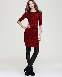 Rich hues invigorate a zebra-print MICHAEL Michael Kors dress, complete with an alluring knotted front for an edgy approach to exotics. Rich hues invigorate a zebra-print MICHAEL Michael Kors dress, complete with an alluring knotted front for an edgy approach to exotics.