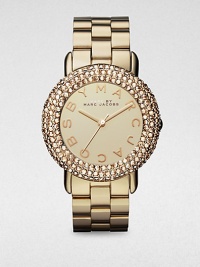 A radiant timepiece with a dazzling crystal encrusted bezel. Quartz movementWater resistant to 5 ATMRound goldtone stainless steel case, 36mm (1.4)Crystal encrusted bezelGoldtone dialLogo hour markersSecond hand Goldtone stainless steel link braceletImported A radiant timepiece with a dazzling crystal encrusted bezel. Quartz movementWater resistant to 5 ATMRound goldtone stainless steel case, 36mm (1.4)Crystal encrusted bezelGoldtone dialLogo hour markersSecond hand Goldtone stainless steel link braceletImported