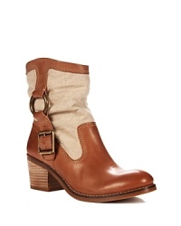 You'll feel fortunate for having scored Lucky Brand's luxe, two-tone take on the Western booties trend. You'll feel fortunate for having scored Lucky Brand's luxe, two-tone take on the Western booties trend.