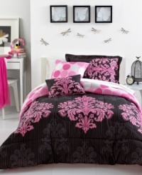 Turn up the pink! The perfect balance of dramatic and whimsical, this Matador comforter set boasts a tonal stripe design embellished with pink medallion designs. Reverses to a pink dot pattern. Turn up the pink! The perfect balance of dramatic and whimsical, this Matador comforter set boasts a tonal stripe design embellished with pink medallion designs. Reverses to a pink dot pattern.