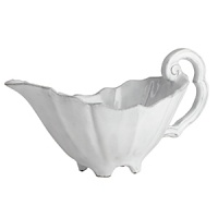 Handmade from Venetian terra marrone, or brown clay, this sauce server brings a rustically sophisticated note to your table. Handmade from Venetian terra marrone, or brown clay, this sauce server brings a rustically sophisticated note to your table.