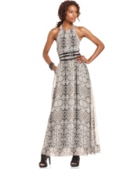 Jessica Simpson's maxi dress is radiant with an animal-inspired print, triple-tiered belt and sexy open-back style. Jessica Simpson's maxi dress is radiant with an animal-inspired print, triple-tiered belt and sexy open-back style.